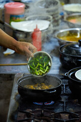 A chef is making jiu jiu pot, a famous Cantonese dish