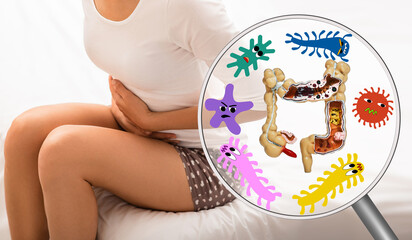 Pain in woman's intestines and abdomen. Dysbacteriosis, inflammation of intestines, abdominal bloating