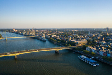 Fototapeta premium View of Cologne, the Rhine river and Cathedral by sunset