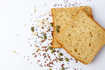 Healthy tasty multigrain bread with pumpkin, chia, flax seeds on white background
