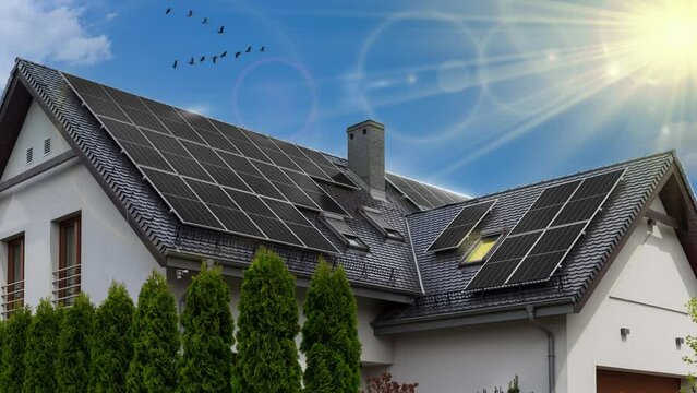 Solar panels on a pitched roof. A beautiful modern home and solar energy. Rays of sunlight. Visualization - video effect, outline