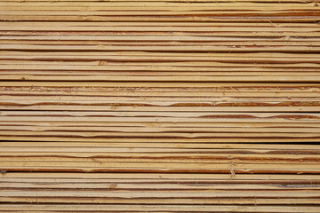 Edged board in stacks. Natural background. Texture.