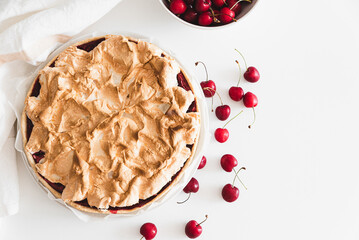 Plate with tasty cherry pie on white background. Top view. Copy space