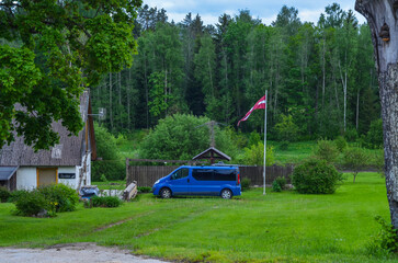 the latvian flag near the house in the village