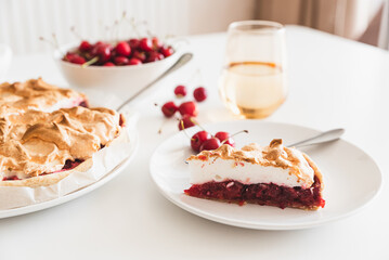 Plate with tasty cherry pie on white background. Front view