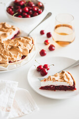 Plate with tasty cherry pie on white background. Front view