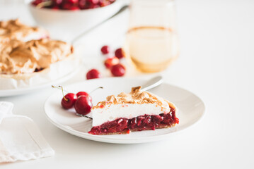 Plate with tasty cherry pie on white background. Front view