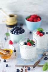 Greek yogurt in glasses with berries and quinoa	