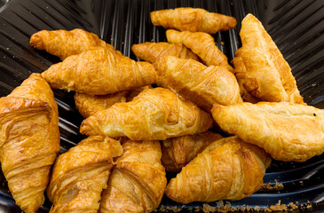Fresh Baked Croissants with Chocolate in Bakery 
