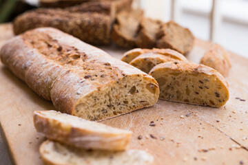 fresh loaf of bread on wooden board