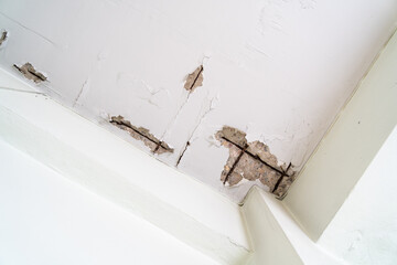 Water damaged ceiling roof in an old house. Water damage building interior. Ceiling house broken....
