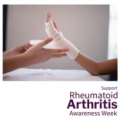 Caucasian doctor wrapping bandage on child's hand and support rheumatoid arthritis awareness week