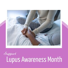 African american woman holding patient's hand in hospital and support lupus awareness month