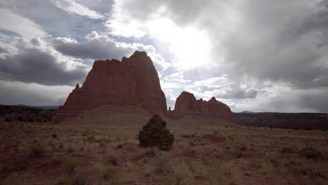 Walking through Cathedral Valley in Capitol Reef during stormy weather in the Utah desert.