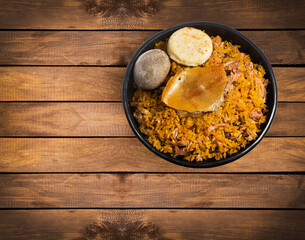 Typical tolimense lechona with rice - Typical Colombian dish