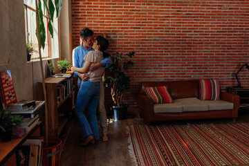 Loving married couple at home