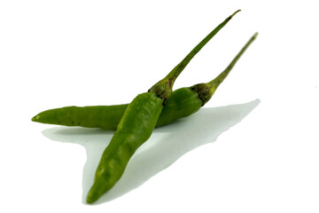 Photo of green chili on white background.