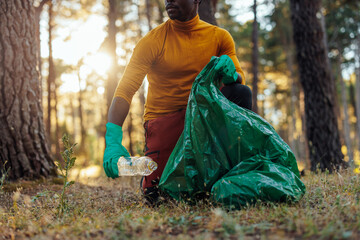 Environmentalist gathering trash from woods