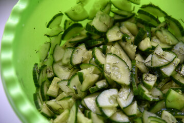 Cucumber and tomato salad with dill in a plate