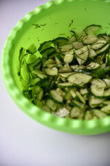 Cucumber and tomato salad with dill in a plate