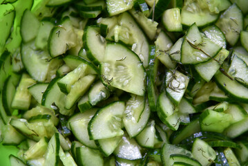 Cucumber and tomato salad with dill in a plate