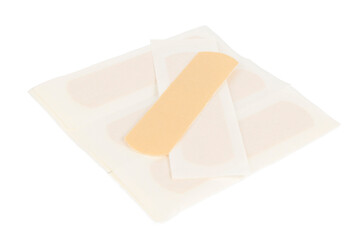 Adhesive plaster on a white background, first aid for abrasions and cuts.