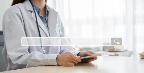 Searching browsing internet bar on Asian woman doctor holding tablet background, Concept of...