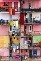authentic different color houses balcony facade wall and  drying clothes on hanging wire