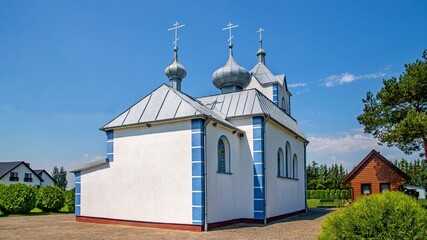 Fototapeta na wymiar General view and architectural details of the temple, the Orthodox Church of the Kaspierowska Icon of the Mother of God, built in 1996, in the village of Widowo in the south of Poland.