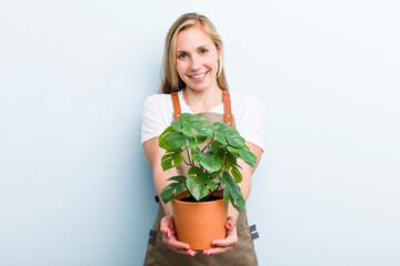 young adult blonde woman. farmer and gardering concept © kues1