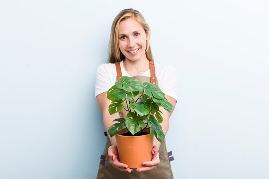 young adult blonde woman. farmer and gardering concept