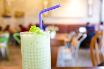Green ice matcha smoothie fresh drink on table