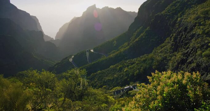 Masca Valley and Gorge, Tenerife, Canarian Islands, Spain. Sunset. Sunlight breaks through the mountain ranges. Amazing view.