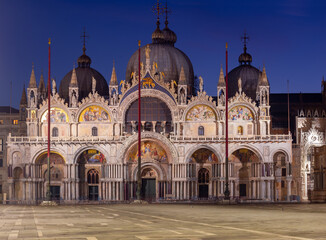 Fototapeta na wymiar Venice. Facade of St. Mark's Cathedral in night illumination at dawn.