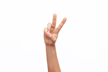 Naklejka premium A female hand with a delicate pink manicure showing a peace gesture isolated on a white background. Victory hand sign