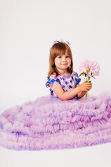 Three year old girl in a lush dress