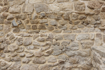 Beige stone wall texture background