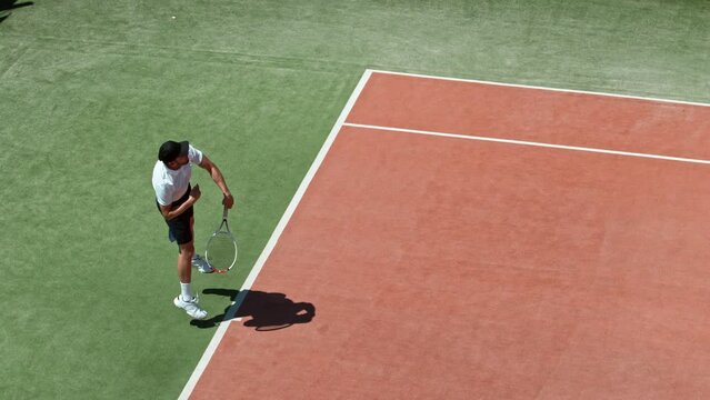 Super slow motion of tennis player hitting the ball in service. Filmed on high speed cinema camera, 1000fps.
