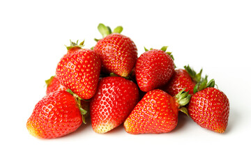 Ripe red strawberries with green leaves on a white background. Selective focus.