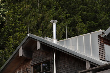 new stainless steel chimney on a house