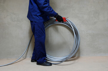 Plumber installing plastic pipes