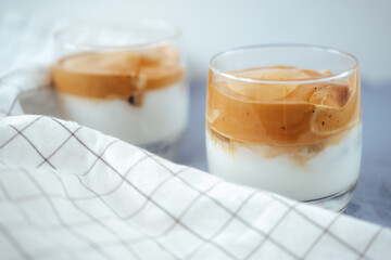 Two glasses of Dalgona coffee on the table.