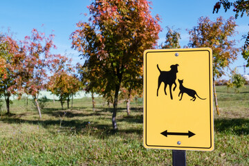 Animal walking area yellow sign in the park