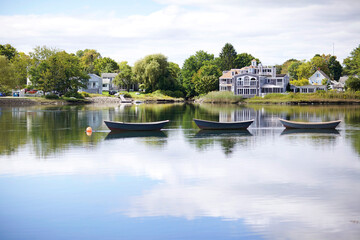 Fototapeta na wymiar Three Rowboats on a Calm Pond