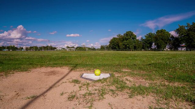Time Lapse,Softball on the homepage in a softball field.