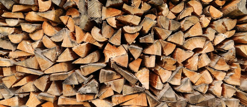 stacked dry firewood as a background 