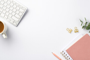 Business concept. Top view photo of workplace keyboard eucalyptus cup of coffee gold binder clips...