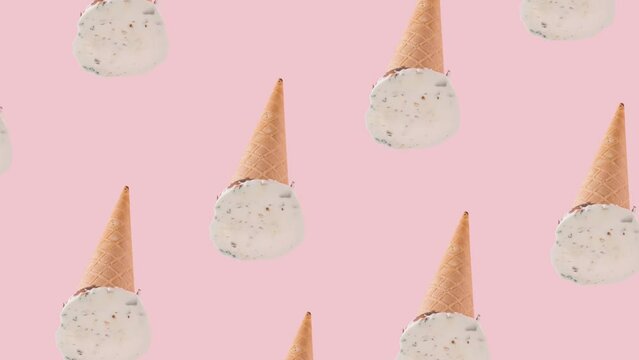 Creative pattern made of vanilla ice cream on a pink background. 4K video.