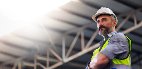 Portrait Caucasian professional Engineer factory. Engineering worker in safety hardhat at factory...