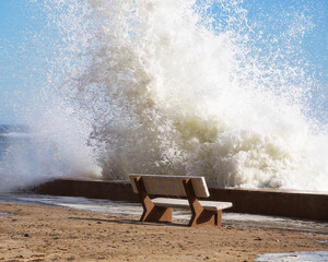 A storm wave hitting seawall